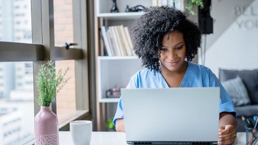 Woman reviewing corporate business credit card options in the Commercial Card Center.